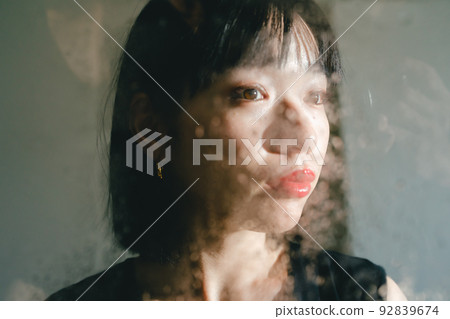 Woman on a rainy day Woman on a rainy day 92839674