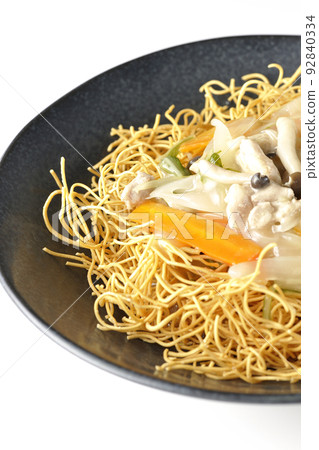 Sara-udon with bean paste containing shimeji mushrooms, carrots, and onions, photographed against a white background Sara-udon with bean paste containing shimeji mushrooms, carrots, and onions, photographed against a white background 92840334