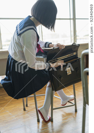 Classroom High school girl looking for something left behind 92840469