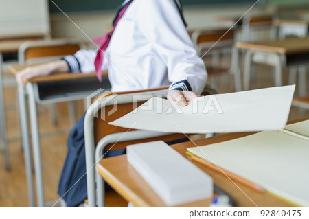 High school girl giving a classroom print High school girl giving a classroom print 92840475