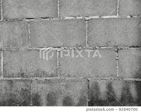 Close-up of White cement crack block wall and peeled paint caused by water and sunlight. Peel wall of White house paint with black stain. Black and White of Texture background. 92840700