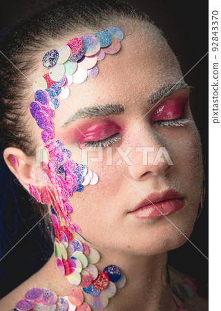 Portrait of a girl with colorful sequins makeup 92843370