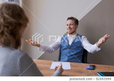 Employer shaking hands smiling to qualified entrepreneurial applicant for job 92843994