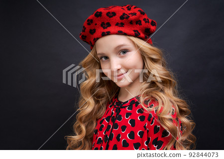 Beautiful attractive fashionable cheerful cheerful long-haired girl in street Beautiful attractive fashionable cheerful cheerful long-haired girl in street 92844073