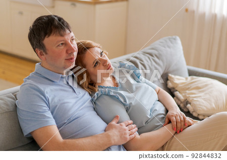 Dreamy married couple happy middle aged people looking into distance, planning 92844832