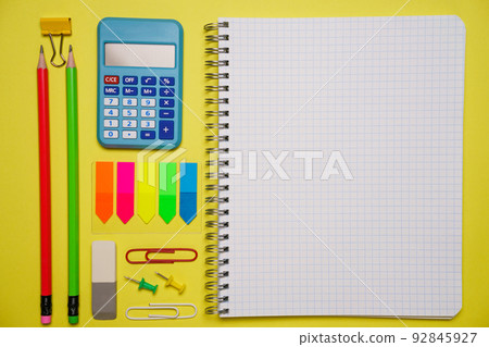 Notebook with a pen and colorful notes on a blue and orange background. Notebook with a pen and colorful notes on a blue and orange background. 92845927