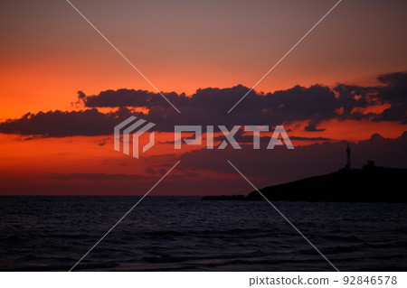 Sunset sky with clouds over the sea in the evening after sunset. Natural Sunset sky with clouds over the sea in the evening after sunset. Natural 92846578