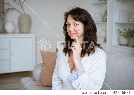 Portrait of beauty woman skin care, brunette girl use roller on healthy fresh Portrait of beauty woman skin care, brunette girl use roller on healthy fresh 92846686