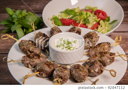 Recipe of kefta, beef skewer, Traditional homemade, with Greek yoghurt sauce, garlic, savory, Arabic Recipe of kefta, beef skewer, Traditional homemade, with Greek yoghurt sauce, garlic, savory, Arabic 92847112