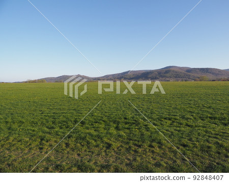 Lawn and Silesian Beskid Mountains in Bielsko-Biala city, Poland 92848407