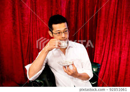 A man who enjoys afternoon tea alone A man who enjoys afternoon tea alone 92851061