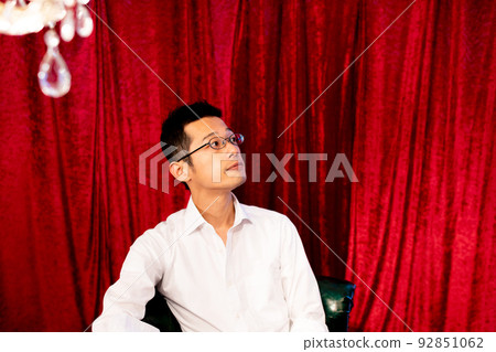 A man lost in thought while remembering the events of the day A man lost in thought while remembering the events of the day 92851062