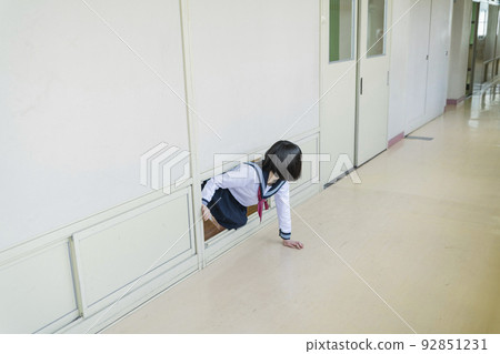 High school girl running away from the classroom 92851231