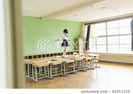 High school girls having fun in the classroom 92851259