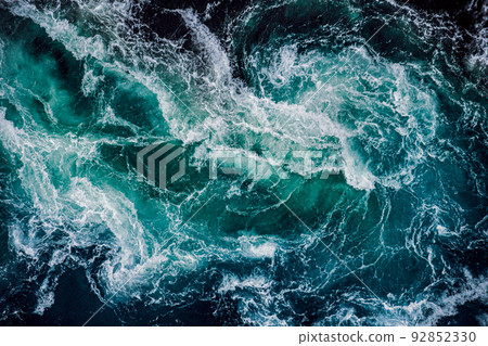 Waves of water of the river and the sea meet each other during high tide and low tide. Waves of water of the river and the sea meet each other during high tide and low tide. 92852330