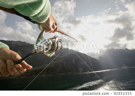 Woman fishing on Fishing rod spinning in Norway. 92852355