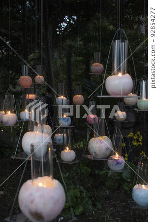 Beautiful event with many candles lit Beautiful event with many candles lit 92854277