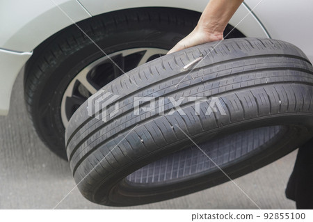 holding car tires and steel pounding through car tires background, object, steel, rust, copy space holding car tires and steel pounding through car tires background, object, steel, rust, copy space 92855100