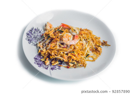 Phad thai, the famous Thai style fried noodle.Signature dish of Thailand. Isolated on white Phad thai, the famous Thai style fried noodle.Signature dish of Thailand. Isolated on white 92857890