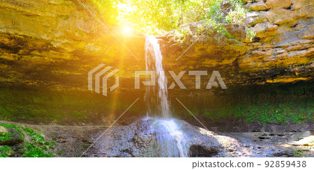 Beautiful waterfall in the forest and sun, Republic of Moldova Wide photo. 92859438