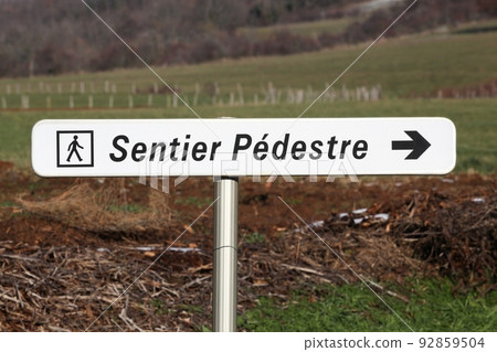 Walking trail signpost called sentier pedestre in french language Walking trail signpost called sentier pedestre in french language 92859504