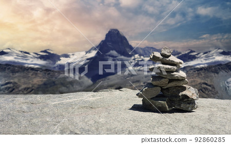 Stack of stones on top of the mountain. Pile of rocks stone and mountains. Balanced stone pyramid or Stacked stone or mountain stones tower. Stones arranged for meditation. Represent spirit of Zen. Stack of stones on top of the mountain. Pile of rocks stone and mountains. Balanced stone pyramid or Stacked stone or mountain stones tower. Stones arranged for meditation. Represent spirit of Zen. 92860285