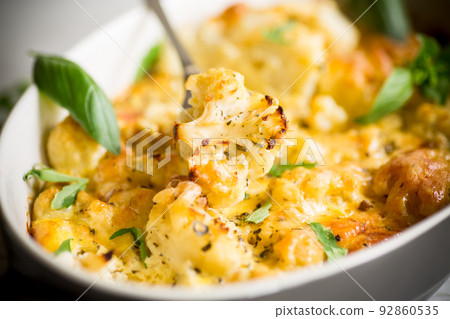 baked cauliflower with vegetables and cheese and scrambled eggs baked cauliflower with vegetables and cheese and scrambled eggs 92860535