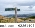 Empty wooden signpost in the mountains. Road sign on the mountain road without information on it 92861405