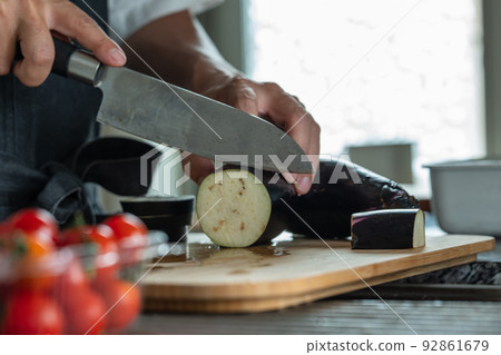 Hands of a man cooking in the kitchen 92861679