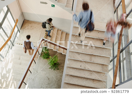 Blurry motion of multicultural students of highschool on staircases 92861779