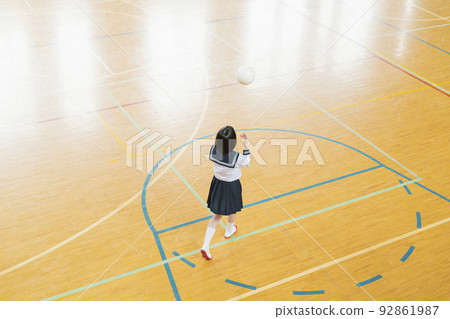 High school girl playing ball in the gym 92861987