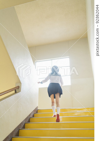 High school girls going up the stairs 92862044