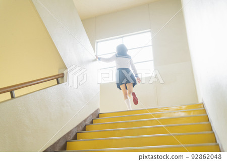 High school girls going up the stairs 92862048