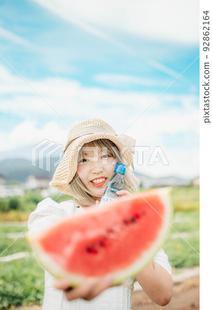 blue sky, watermelon and white dress woman 92862164