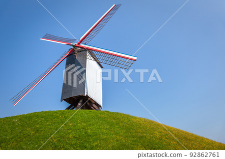Rustic wooden windmills in idyllic Bruges public park, Belgium Rustic wooden windmills in idyllic Bruges public park, Belgium 92862761