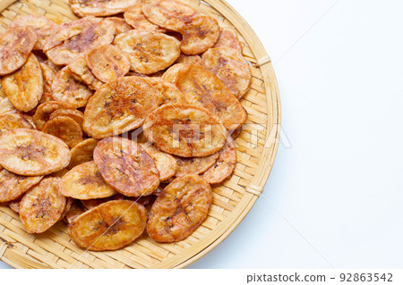 Banana chips on white background 92863542
