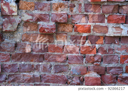 The texture of old brick wall in close-up. The texture of old brick wall in close-up. 92866217