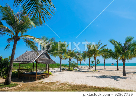 Relax cabin surrounding with coconut trees on Cha Am beach 92867759