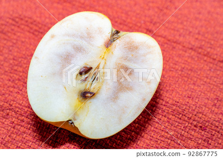 A picture of a rotten apple. 92867775