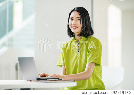 Caregiver woman doing office work Caregiver woman doing office work 92869170