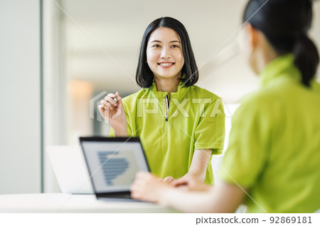 Female caregiver having a meeting Female caregiver having a meeting 92869181