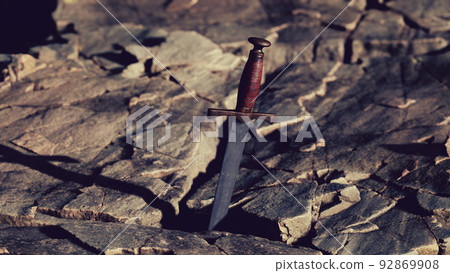 Excalibur sword in rocky stone at sunset Excalibur sword in rocky stone at sunset 92869908