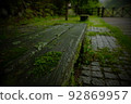 grassy cobblestones and benches 92869957