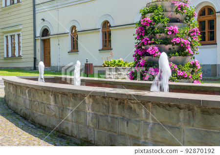 Streams of water fountain on Cieszyn castle hill in Poland. Streams of water fountain on Cieszyn castle hill in Poland. 92870192