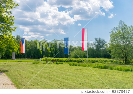 Flags of Czech Republic, Europe Union and Poland in Sudetes on border of three countries. Flags of Czech Republic, Europe Union and Poland in Sudetes on border of three countries. 92870457