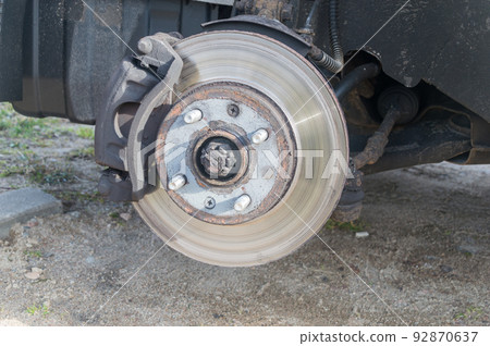 Disc brake of the vehicle. Car brake repairing. Disc brake of the vehicle. Car brake repairing. 92870637