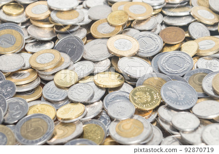 PLN, polish zloty coins as background. 92870719