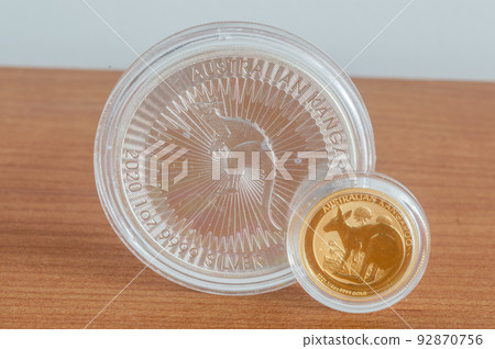 Australian Kangaroo silver and gold coins. 1oz silver coin and quarter oz gold coin. Australian Kangaroo silver and gold coins. 1oz silver coin and quarter oz gold coin. 92870756
