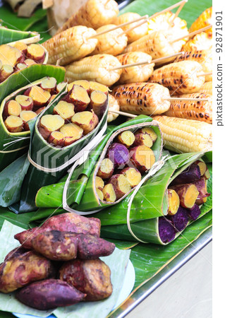 Thai Sweet potatoes steamed and wrapped in banana leaf. Thai Sweet potatoes steamed and wrapped in banana leaf. 92871901