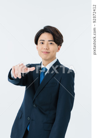 A young businessman wearing a suit A young businessman wearing a suit 92872412